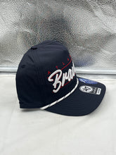 Load image into Gallery viewer, Atlanta Braves MLB '47 Brand Navy Blue Script Hitch Rope Adjustable Snapback Hat worn by a fan at a game, emphasizing team spirit and style.