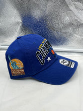Load image into Gallery viewer, Person wearing the Kentucky Wildcats NCAA '47 Brand Blue 1996 Champs Clean Up Adjustable Hat while cheering in a stadium.