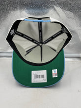 Load image into Gallery viewer, Styled flat lay showing the North Carolina Tar Heels NCAA '47 Champs Off White Hitch Adjustable Snapback Hat.