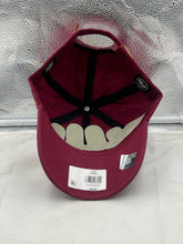 Load image into Gallery viewer, Lifestyle shot of a person wearing the Washington Commanders NFL '47 Brand Red Clean Up Adjustable Strapback Hat at a tailgate, demonstrating its stylish design and comfortable fit.