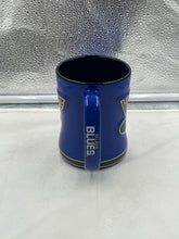 Load image into Gallery viewer, Close-up view of St. Louis Blues NHL Logo Brands 14oz Mug, showcasing its durable ceramic design and official team branding.