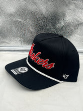 Load image into Gallery viewer, Close-up view of the Nebraska Cornhuskers NCAA '47 Brand Black Script Hitch Adjustable Snapback Hat featuring the bold script logo.