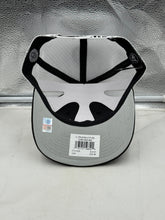 Load image into Gallery viewer, Person wearing the Tulane Green Wave NCAA '47 Brand Black Trucker Mesh Adjustable Snapback Hat, demonstrating team spirit while enjoying a casual outing.