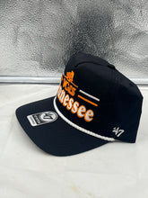 Load image into Gallery viewer, Tennessee Volunteers NCAA '47 Throwback Black Hitch Snapback Adjustable Hat displayed on a wooden surface, showcasing its stylish black design.
