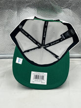 Load image into Gallery viewer, Stylish Boston Celtics NBA '47 Brand White Script Hitch Rope Adjustable Snapback Hat on a table, emphasizing its trendy design and suitability for any Celtics supporter.