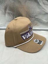 Load image into Gallery viewer, Lifestyle image of a person wearing the Minnesota Vikings NFL '47 Khaki Script Hitch Rope Snapback Adjustable Hat at a tailgate event.
