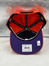 Load image into Gallery viewer, Model wearing the Clemson Tigers NCAA '47 Brand Orange Script Rope Hitch Adjustable Snapback Hat at a game, showcasing team pride and casual style.