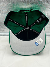 Load image into Gallery viewer, Lifestyle image of a person wearing the Oregon Ducks NCAA '47 Brand Green Hitch Adjustable Snapback Hat at a sports event, highlighting team spirit and style.