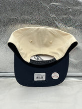 Load image into Gallery viewer, Atlanta Braves hat displayed on a rustic wooden background, highlighting the adjustable snapback feature for a comfortable fit.