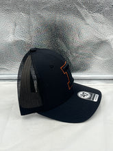 Load image into Gallery viewer, Lifestyle image featuring a person wearing the Illinois Fighting Illini NCAA '47 Brand Black Trucker Adjustable Snapback Hat during a casual outing.