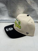 Load image into Gallery viewer, Close-up view of the Oregon Ducks '47 Brand Natural TT Hitch Adjustable Snapback Hat, highlighting the iconic team logo and classic natural color scheme.