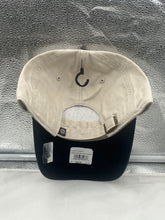 Load image into Gallery viewer, Winnipeg Jets NHL '47 Brand Natural Two Tone Clean Up Adjustable Strapback Hat worn by a fan at a hockey game, emphasizing team spirit and comfort.