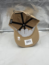 Load image into Gallery viewer, Model wearing the Tulane Green Wave hat, showcasing how it pairs well with casual outfits while displaying school pride.