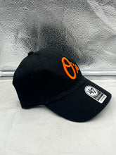 Load image into Gallery viewer, Close-up of the Baltimore Orioles MLB '47 Brand Black Clean Up Adjustable Hat featuring adjustable strap and curved visor for a relaxed fit.