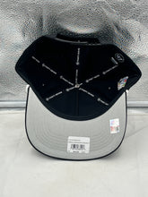 Load image into Gallery viewer, Model wearing the Nebraska Cornhuskers NCAA '47 Brand Black Script Hitch Adjustable Snapback Hat in a casual outdoor setting.