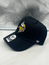 Load image into Gallery viewer, Close-up view of the Minnesota Vikings NFL '47 Brand Black Clean Up Strapback Adjustable Hat, highlighting its adjustable strapback feature and quality materials.