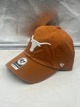 Load image into Gallery viewer, Texas Longhorns NCAA '47 Brand Orange Clean Up Adjustable Strapback Hat worn by a fan, demonstrating the hat's relaxed fit and stylish design at a gameday event.
