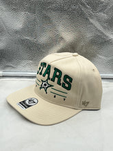 Load image into Gallery viewer, Close-up view of the Dallas Stars NHL '47 Brand Natural Script Roscoe Hitch Adjustable Snapback Hat showcasing the iconic team logo.