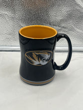 Load image into Gallery viewer, a black and gold coffee mug with a tiger on it