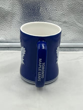 Load image into Gallery viewer, Close-up view of the Toronto Maple Leafs NHL Blue 14oz Coffee Mug Cup, showcasing its vibrant color and durable construction by Logo Brands.