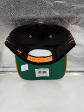 Load image into Gallery viewer, Person wearing the Tampa Bay Buccaneers NFL '47 Brand Black Diamond Hitch Snapback Adjustable Hat outdoors, demonstrating comfort and trendy design for game-day attire.