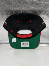 Load image into Gallery viewer, Atlanta Falcons hat worn by a fan at a game highlighting the black color and team spirit, perfect accessory for any fan.