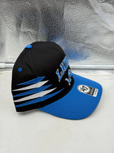Load image into Gallery viewer, Detroit Lions NFL '47 Brand Black TT Diamond Hitch Snapback Adjustable Hat displayed on a table, capturing its modern design and the iconic Lions logo for fans looking to enhance their game day outfit.