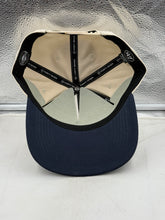 Load image into Gallery viewer, Flat lay of the Notre Dame Fighting Irish NCAA '47 Orange Bowl Natural TT Hitch Snapback Hat on a textured surface, emphasizing its stylish design and perfect for showcasing your support for the Notre Dame Fighting Irish hat.