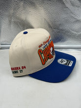 Load image into Gallery viewer, Model wearing the Nebraska Cornhuskers NCAA '47 Orange Bowl Natural TT Hitch Snapback Hat at a football game, representing the ultimate Nebraska Cornhuskers hat.