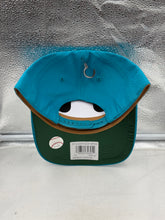 Load image into Gallery viewer, Miami Marlins hat worn outdoors, demonstrating the stylish and comfortable fit of the Throwback MLB '47 Brand Teal Hitch Adjustable Snapback Hat.