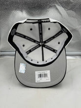 Load image into Gallery viewer, Lifestyle image of a person wearing the Dallas Stars NHL '47 Brand White Diamond Hitch Adjustable Snapback Hat at a hockey game, demonstrating the comfort stylish choice of a Dallas Stars hat.