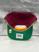 Load image into Gallery viewer, A person wearing the Florida State Seminoles FSU NCAA '47 Throwback Red Hitch Adjustable Snapback Hat while enjoying a sunny day, illustrating the hat's comfortable and stylish design.