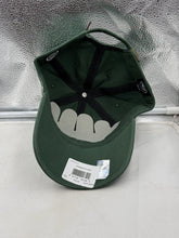 Load image into Gallery viewer, Flat lay of the Minnesota Wild NHL '47 Brand Green Clean Up Adjustable Hat with outdoor background, perfect for showcasing team pride.