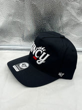 Load image into Gallery viewer, Close-up view of the Cincinnati Bearcats NCAA '47 Brand Black Hitch Script Adjustable Snapback Hat, highlighting the quality fabric and adjustable snapback closure.