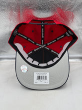 Load image into Gallery viewer, Model wearing the Atlanta Braves MLB '47 Brand Red TT Diamond Hitch Adjustable Snapback Hat at a baseball game.