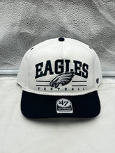 Load image into Gallery viewer, Philadelphia Eagles NFL '47 White TT Roscoe Hitch Rope Snapback Adjustable Hat displayed on a wooden table with a blurred stadium background.