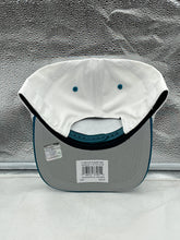 Load image into Gallery viewer, Model wearing the Jacksonville Jaguars NFL '47 White TT Roscoe Hitch Rope Snapback Adjustable Hat during a sunny day, demonstrating its versatile and comfortable fit for sports fans.