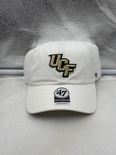 Load image into Gallery viewer, UCF Golden Knights NCAA '47 Brand White Clean Up Adjustable Strapback Hat displayed on a table, showcasing its clean design and durable materials.