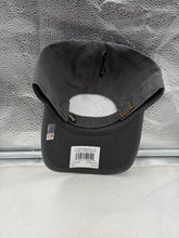 Load image into Gallery viewer, Model wearing the UCF Golden Knights NCAA '47 Brand Gray Clean Up Adjustable Strapback Hat outdoors during a sunny day, demonstrating its comfortable fit.