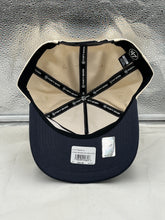 Load image into Gallery viewer, a new era hat with a black and tan visor