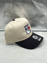 Load image into Gallery viewer, a white and black hat sitting on top of a counter