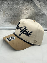 Load image into Gallery viewer, a new york yankees hat sitting on a window sill