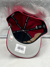 Load image into Gallery viewer, a red and grey hat sitting on top of a window sill