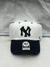 Load image into Gallery viewer, a new york yankees hat sitting on top of a table