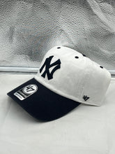 Load image into Gallery viewer, a new york yankees hat sitting on a window sill