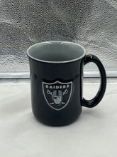 Load image into Gallery viewer, Las Vegas Raiders NFL Black 14oz Coffee Mug Cup featuring the iconic Raiders logo, perfect for fans to enjoy their favorite beverages in style.