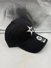 Load image into Gallery viewer, Person wearing the Vanderbilt Commodores NCAA '47 Throwback Black Clean Up Adjustable Strapback Hat at a game, representing fan spirit with this stylish Vanderbilt Commodores hat.