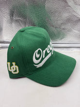 Load image into Gallery viewer, Oregon Ducks hat displayed against casual wear, emphasizing its versatility for game days and everyday outings.