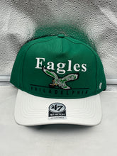 Load image into Gallery viewer, Philadelphia Eagles NFL '47 Throwback Green TT Hitch Snapback Adjustable Hat displayed on a wooden surface highlighting its vibrant green color and adjustable snapback design.