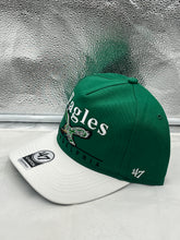Load image into Gallery viewer, Close-up view of the Philadelphia Eagles NFL '47 Throwback Green TT Hitch Snapback Adjustable Hat showcasing the embroidered Eagles logo and throwback design details.